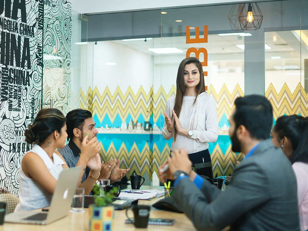 Team members collaborating in the office